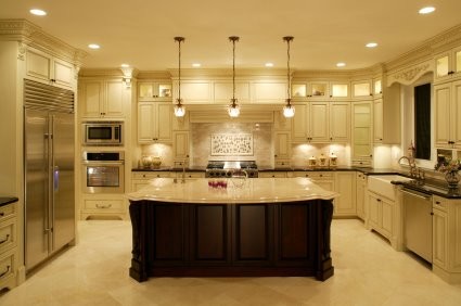 Inspiration for a large traditional galley separate kitchen in Los Angeles with a drop-in sink, recessed-panel cabinets, light wood cabinets, granite benchtops, stainless steel appliances, marble floors, with island, beige splashback and porcelain splashback.