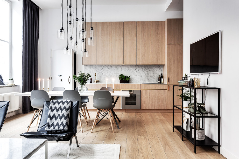 This is an example of a large scandinavian kitchen in Stockholm with medium hardwood floors.