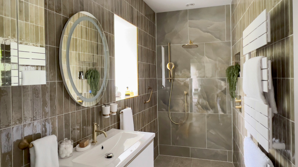 Inspiration for a small rural ensuite wet room bathroom in Gloucestershire with beaded cabinets, white cabinets, a one-piece toilet, green tiles, marble tiles, green walls, terrazzo flooring, an integrated sink, an open shower, a feature wall, a single sink and a floating vanity unit.
