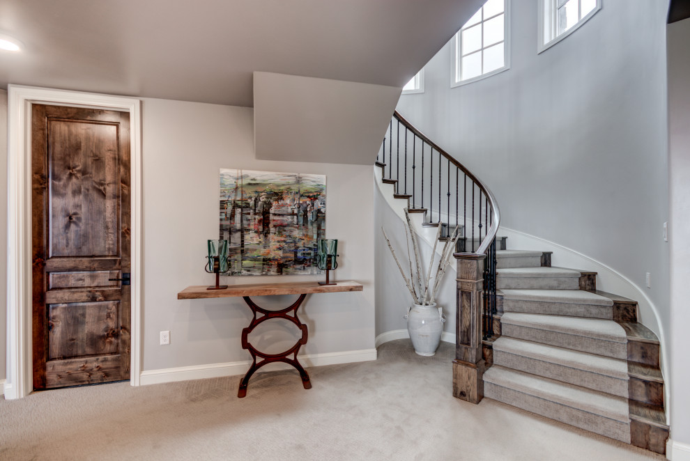 Example of a transitional home design design in Denver