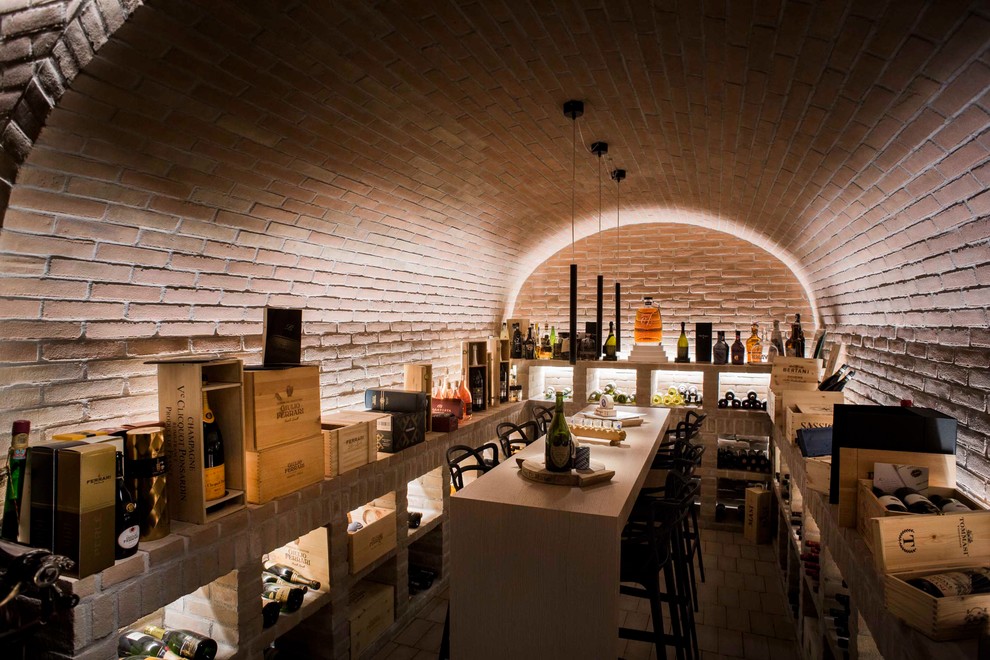 Photo of a mediterranean wine cellar in Venice with brick floors.