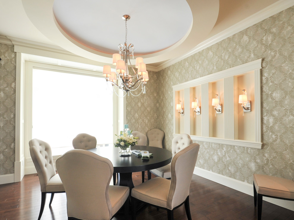 Inspiration for a mid-sized traditional dining room in Edmonton with beige walls, dark hardwood floors and no fireplace.