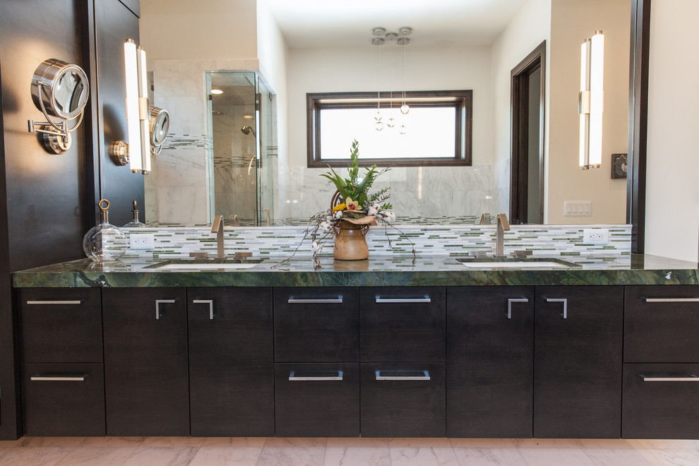 Inspiration for a mid-sized contemporary master bathroom in Salt Lake City with an undermount sink, flat-panel cabinets, dark wood cabinets, marble benchtops, an alcove tub, an alcove shower, a one-piece toilet, green tile, mosaic tile, beige walls and ceramic floors.