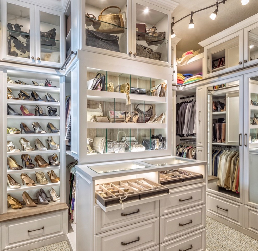 Design ideas for a traditional women's walk-in wardrobe in Miami with raised-panel cabinets, white cabinets, carpet and grey floor.