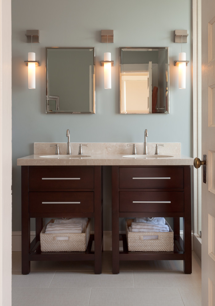 Photo of a mid-sized transitional master bathroom in DC Metro with furniture-like cabinets, dark wood cabinets, blue walls, ceramic floors, an undermount sink, soapstone benchtops and beige floor.
