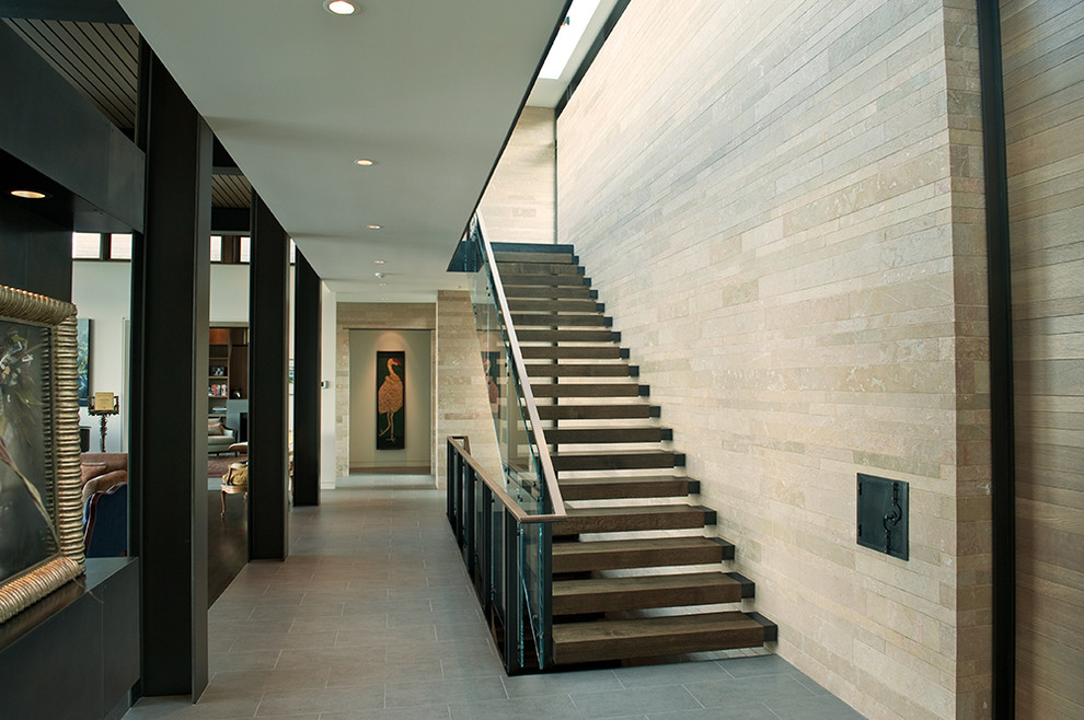 Contemporary wood straight staircase in Seattle with open risers.