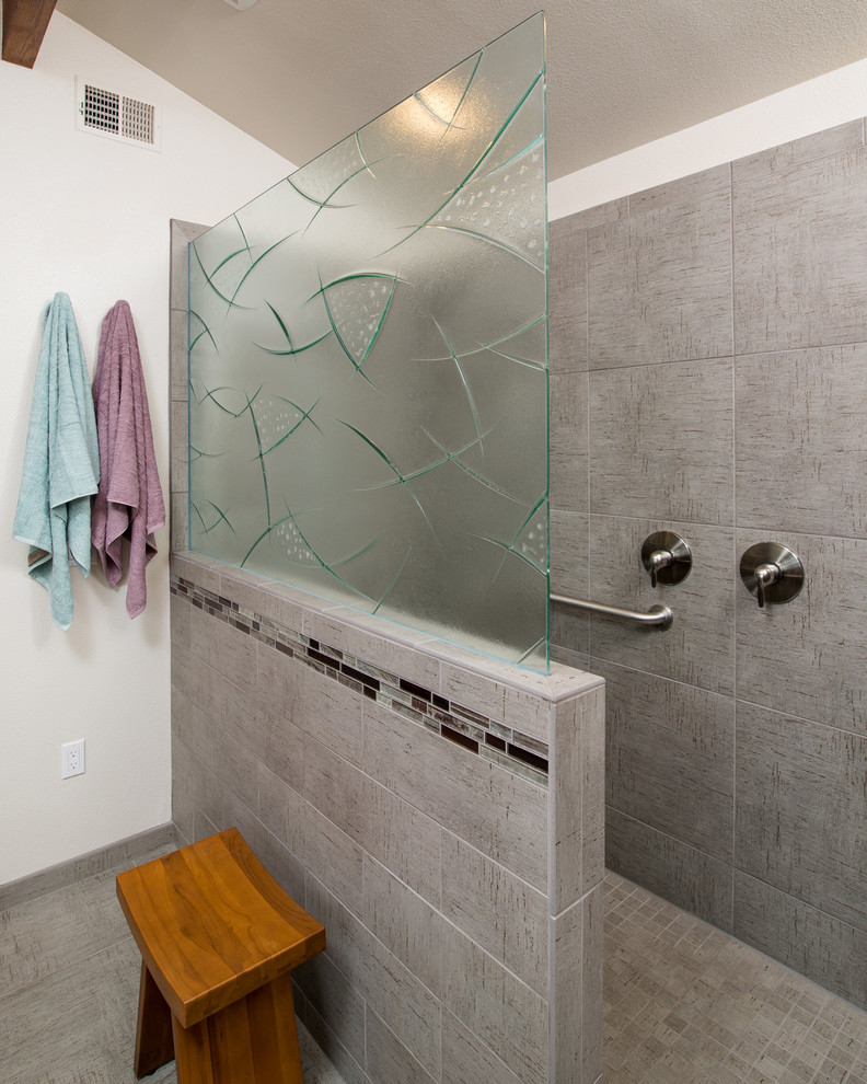 This is an example of a mid-sized contemporary master bathroom in San Diego with a drop-in sink, flat-panel cabinets, light wood cabinets, granite benchtops, an open shower, a one-piece toilet, gray tile, ceramic tile, white walls and ceramic floors.