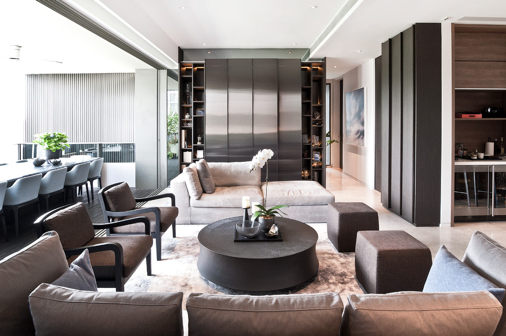 Inspiration for a contemporary formal open concept living room in Singapore with a concealed tv.