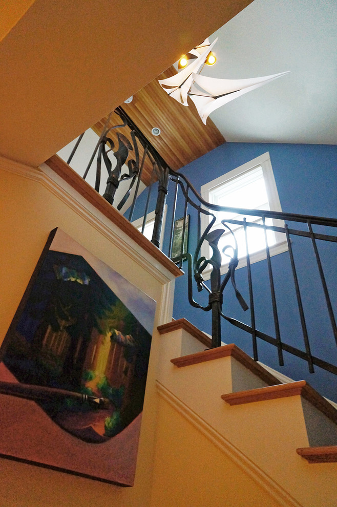 Photo of a transitional wood u-shaped staircase in Boston.