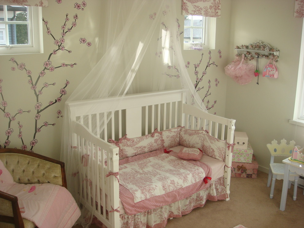 This is an example of an eclectic kids' bedroom for girls in Other with white walls and carpet.