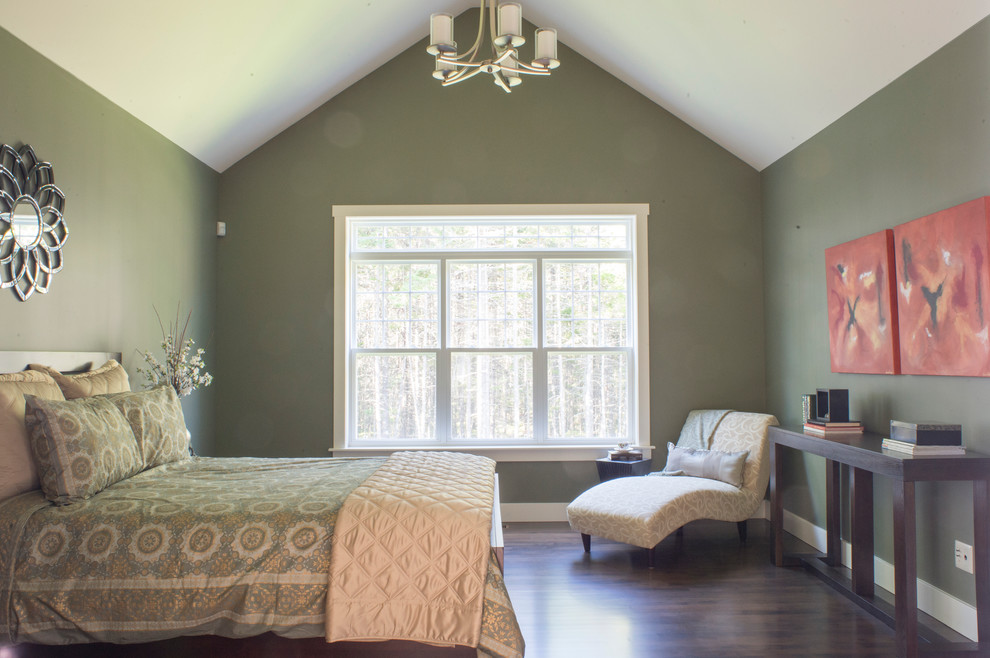 This is an example of a large transitional master bedroom in Other with green walls and dark hardwood floors.