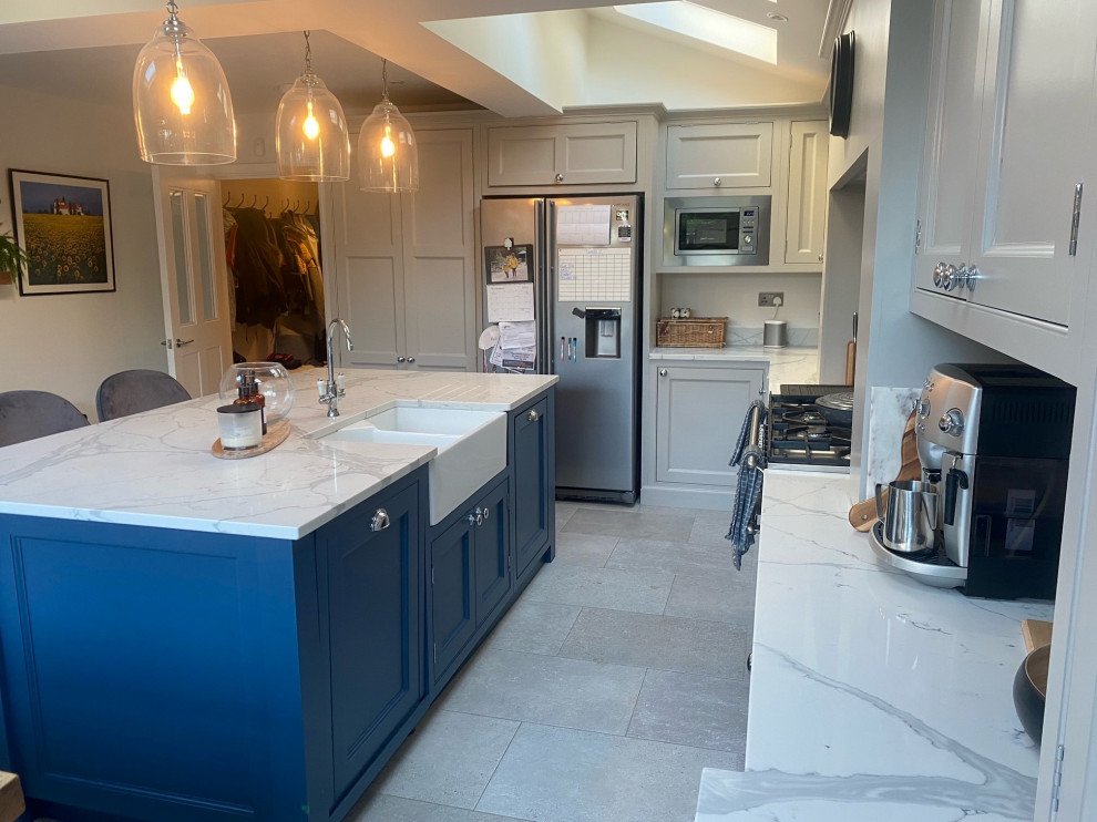 Design ideas for a traditional kitchen in Other with beaded cabinets, grey cabinets, quartz worktops, white splashback, engineered quartz splashback, an island and white worktops.