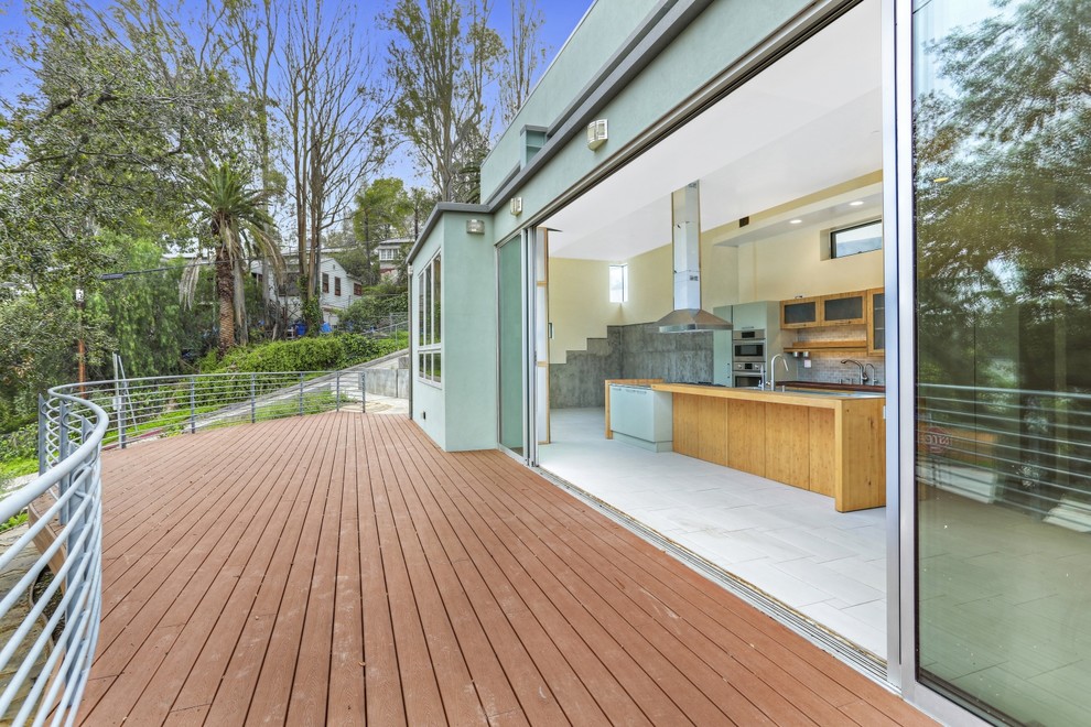 This is an example of a large modern backyard deck in Los Angeles with no cover.