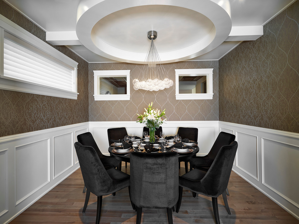 Design ideas for a transitional separate dining room in Edmonton with brown walls and dark hardwood floors.