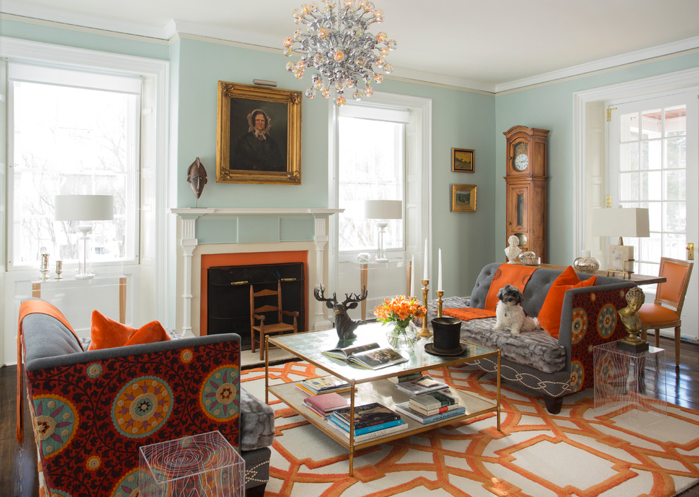 This is an example of a traditional formal living room in San Francisco with blue walls and a standard fireplace.
