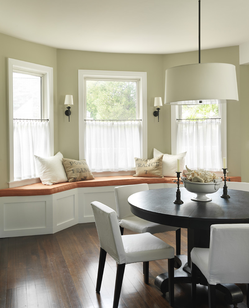 Design ideas for a traditional dining room in Providence with beige walls and dark hardwood floors.
