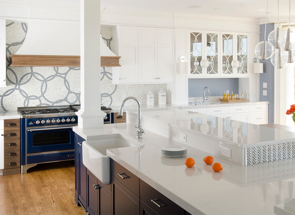 Design ideas for a contemporary kitchen in Portland Maine with a farmhouse sink, quartz benchtops, multi-coloured splashback, mosaic tile splashback, coloured appliances, recessed-panel cabinets and white cabinets.