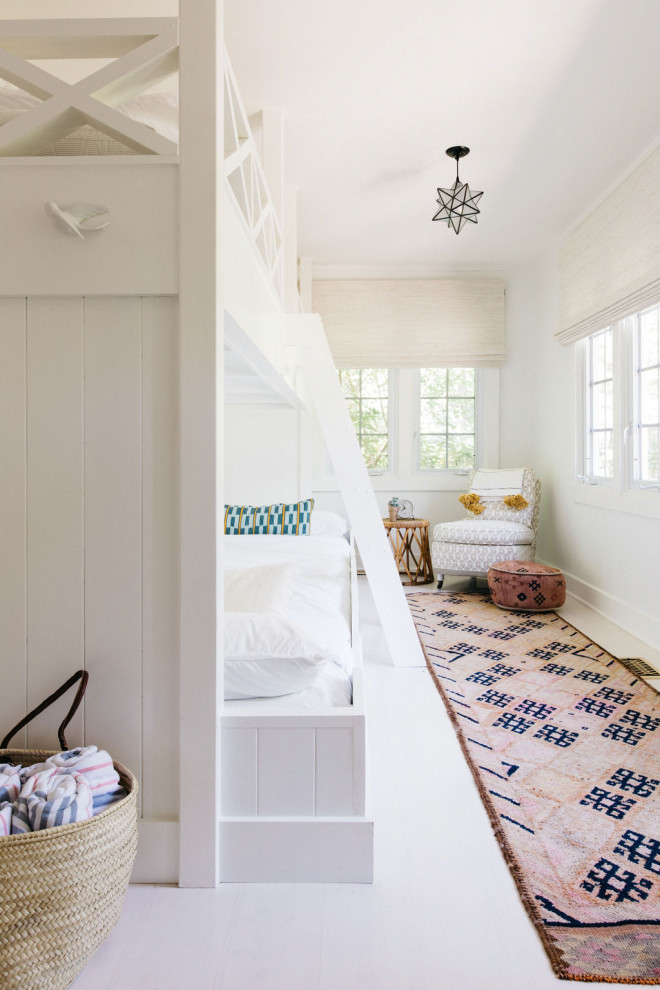 Leo Cottage - Example of a beach style home design design in Denver