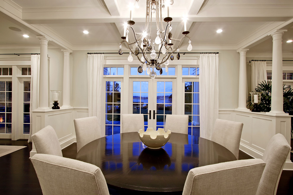 Inspiration for a traditional dining room in Seattle with dark hardwood floors and grey walls.