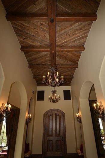 Example of a large transitional foyer design in Phoenix with beige walls and a dark wood front door