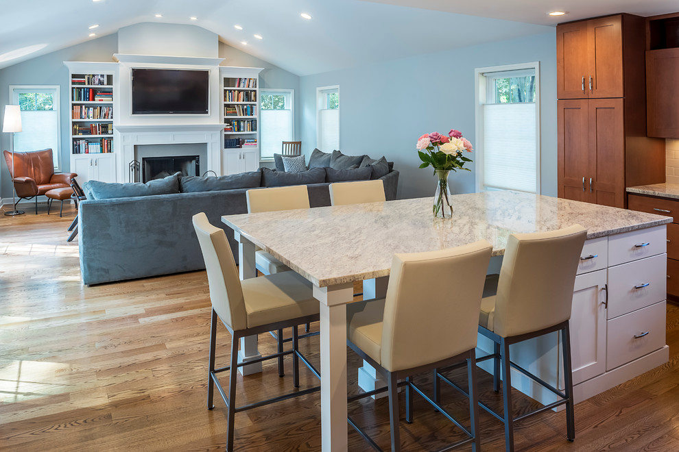 Eat-in kitchen - mid-sized transitional u-shaped light wood floor eat-in kitchen idea in Chicago with a drop-in sink, recessed-panel cabinets, white cabinets, marble countertops, white backsplash, subway tile backsplash, stainless steel appliances and an island