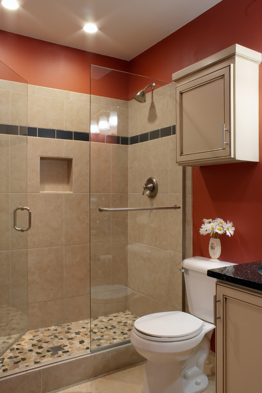 Photo of a traditional 3/4 bathroom in Seattle with an undermount sink, shaker cabinets, beige cabinets, quartzite benchtops, beige tile, ceramic tile and orange walls.