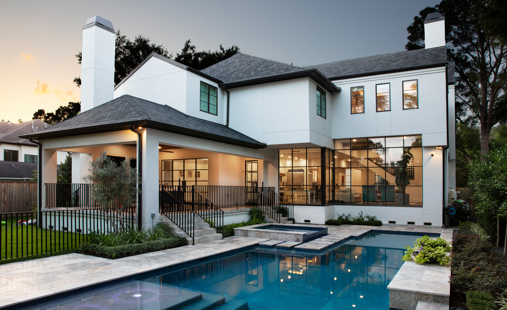 This is an example of a country backyard custom-shaped pool in Houston with a pool house.