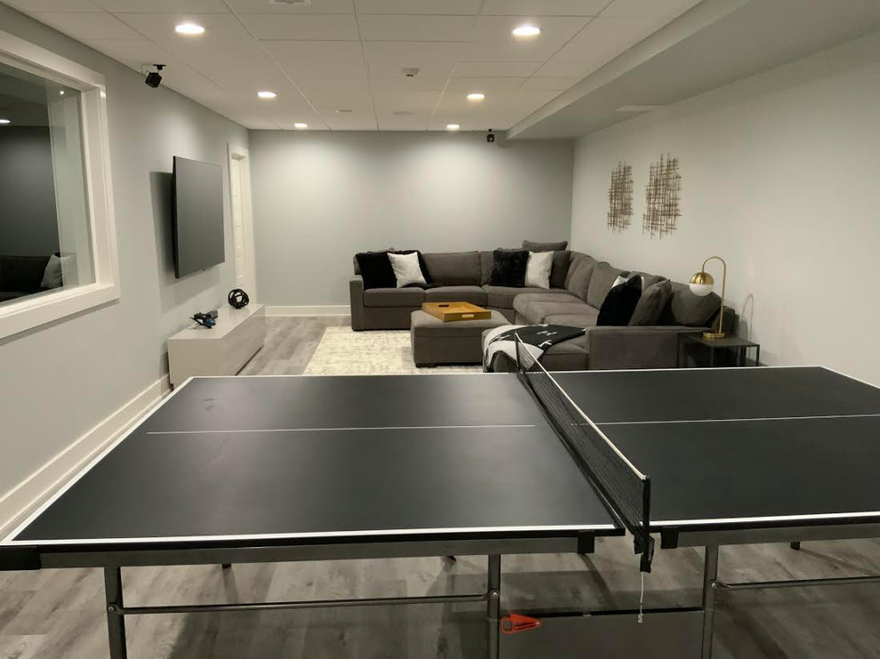 A Transitional Fun Family Basement with Bathroom, Gym, Movie Room and Gaming Ar