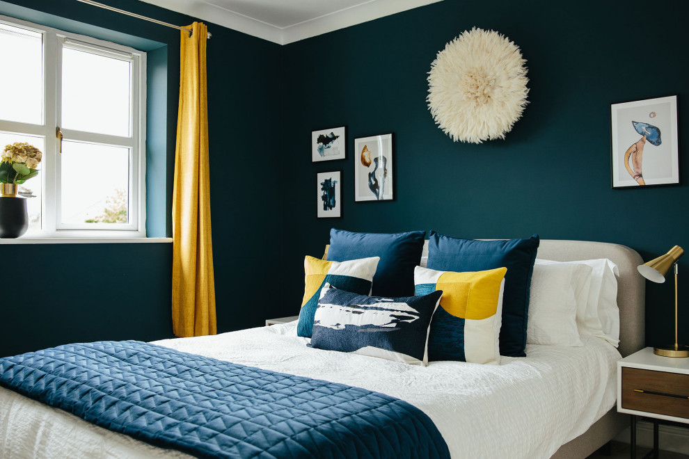 Photo of a medium sized traditional guest bedroom in London with blue walls.