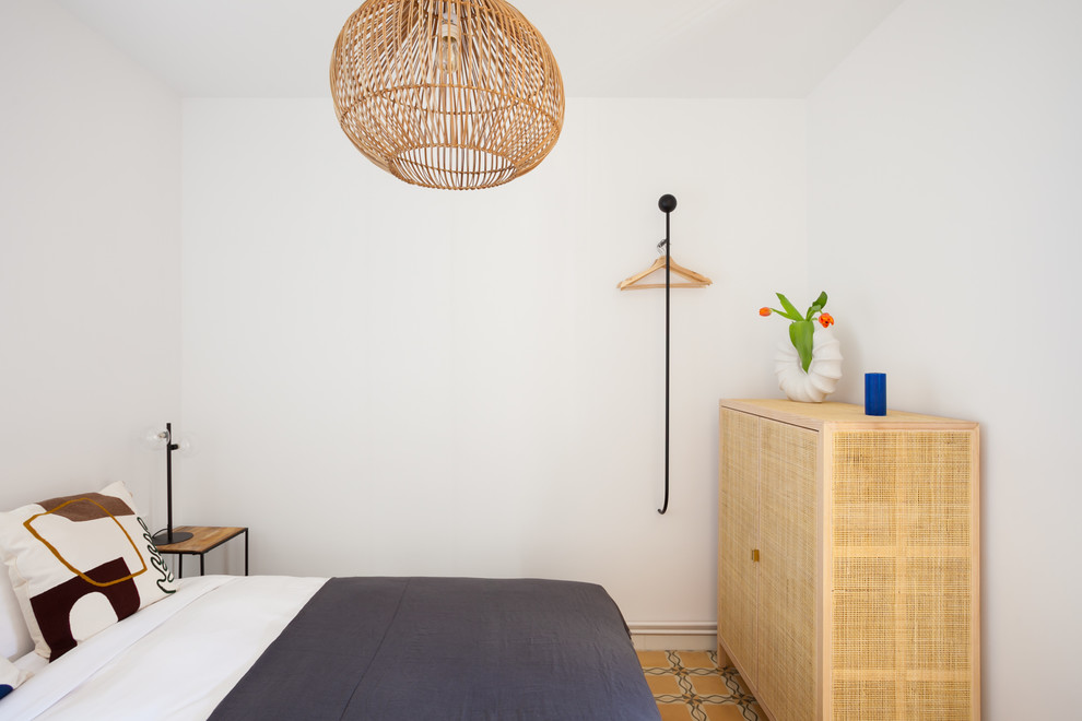 Photo of a small mediterranean master bedroom in Barcelona with white walls and ceramic floors.