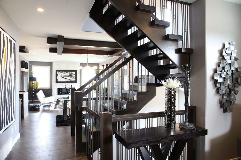 Photo of a mid-sized transitional wood u-shaped staircase in Other with wood risers.