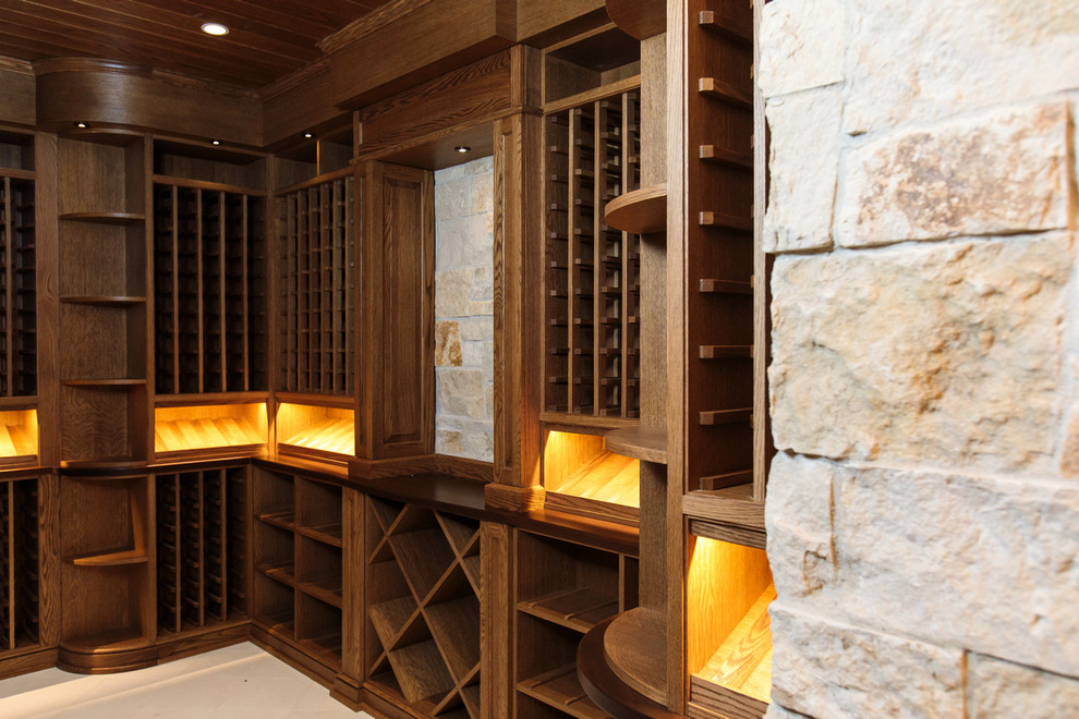 Inspiration for a large traditional wine cellar in Boston with storage racks and beige floor.