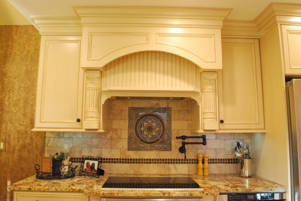 Mid-sized eat-in kitchen photo with beaded inset cabinets, beige cabinets, granite countertops, brown backsplash, ceramic backsplash and stainless steel appliances