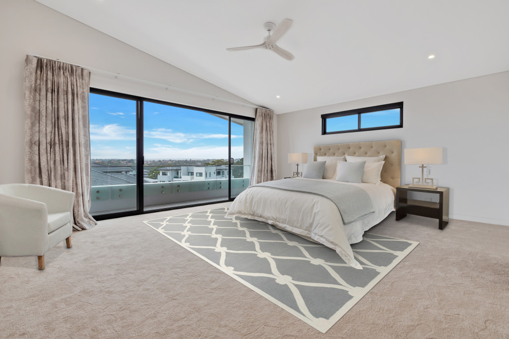 Inspiration for a modern guest bedroom in Sydney with white walls and carpet.