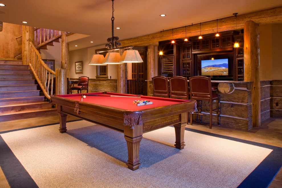 Example of a large mountain style walk-out beige floor basement design with beige walls