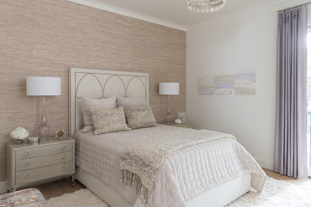 Inspiration for a large guest bedroom in Dallas with white walls, light hardwood flooring and wallpapered walls.