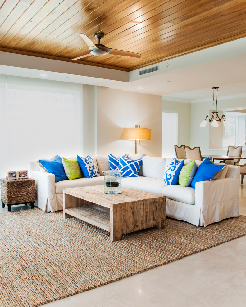 Photo of a mid-sized beach style formal open concept living room in Miami with beige walls.