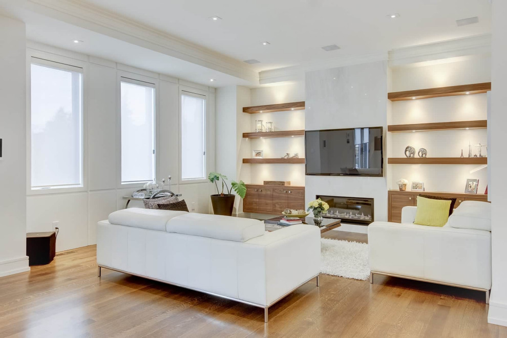 Design ideas for a mid-sized transitional formal open concept living room in Toronto with white walls, medium hardwood floors, no fireplace, a stone fireplace surround, a built-in media wall, brown floor, recessed and wood walls.