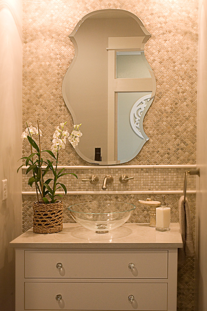 This is an example of a tropical powder room in Other.