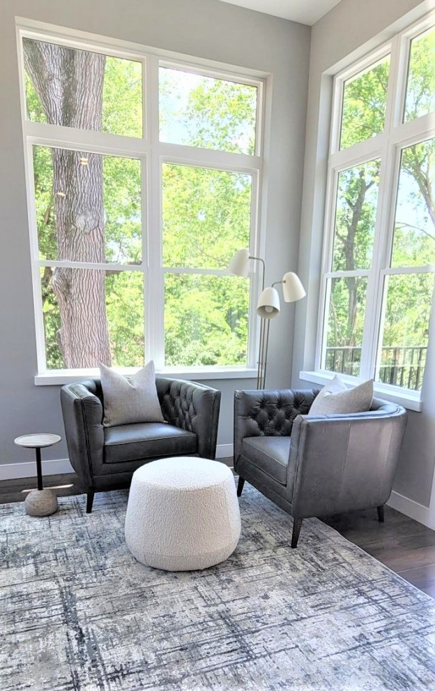 Sunroom - transitional medium tone wood floor and brown floor sunroom idea in Cedar Rapids