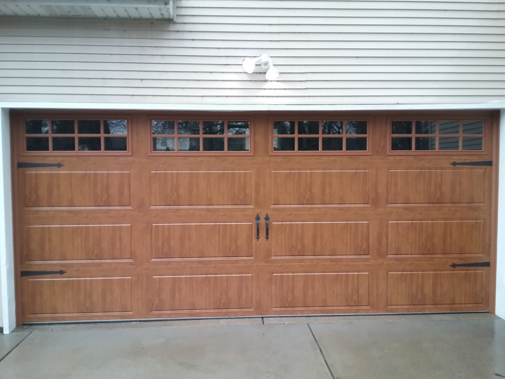 This is an example of a mid-sized traditional attached two-car garage in St Louis.