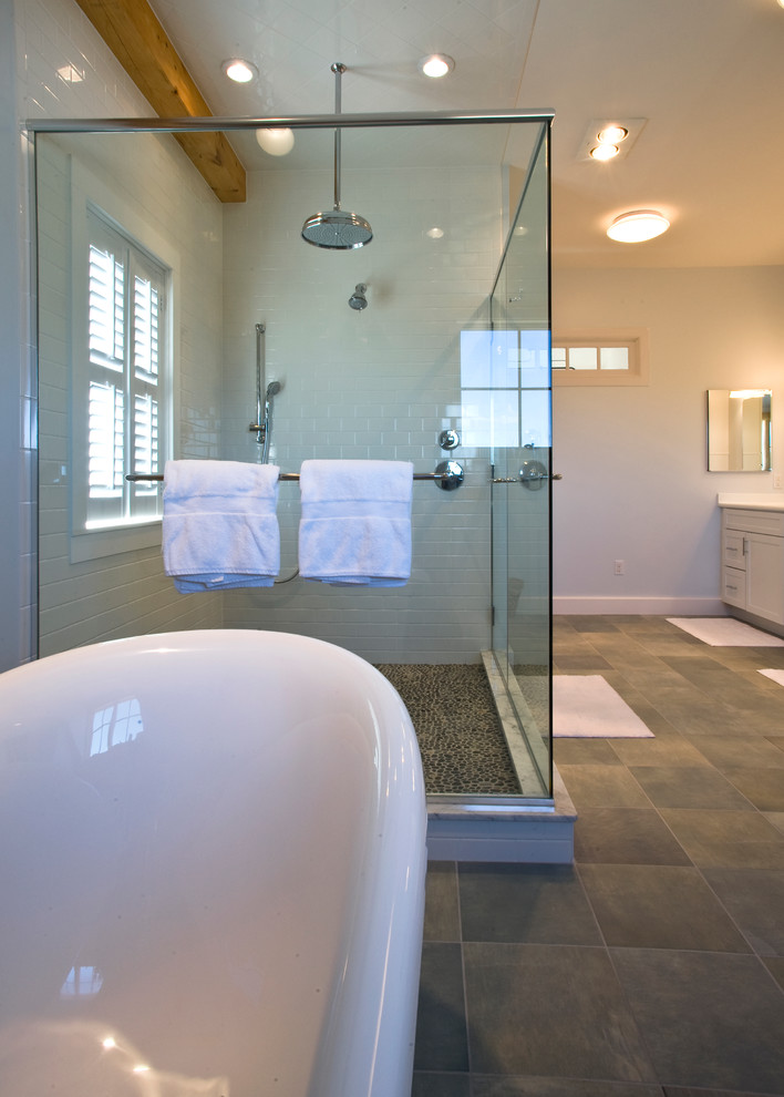 Design ideas for a large traditional master bathroom in Portland Maine with recessed-panel cabinets, white cabinets, a claw-foot tub, an alcove shower, white tile, subway tile, grey walls, slate floors, an undermount sink, engineered quartz benchtops, grey floor and a hinged shower door.