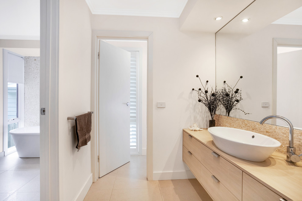 Photo of a beach style home design in Melbourne.