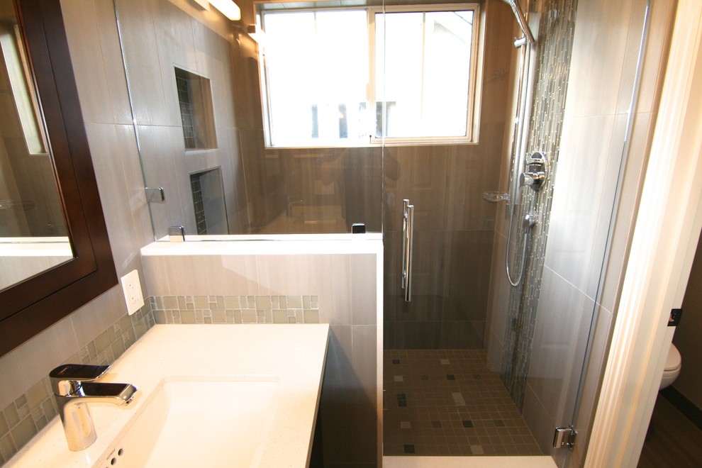 Mid-sized contemporary master bathroom in San Francisco with an undermount sink, flat-panel cabinets, dark wood cabinets, engineered quartz benchtops, an alcove shower, gray tile, ceramic tile, ceramic floors, a two-piece toilet and grey walls.