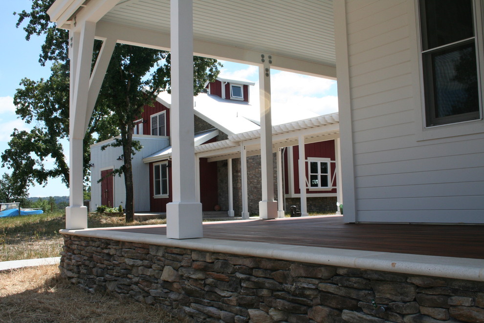 This is an example of an expansive country front yard verandah in San Francisco with decking and a roof extension.