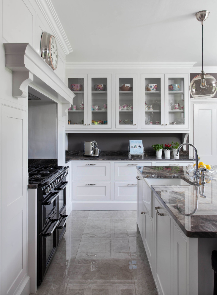 This is an example of a medium sized farmhouse l-shaped kitchen in Other with shaker cabinets and white cabinets.