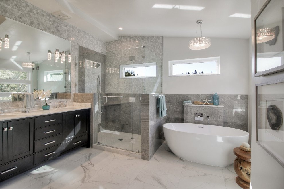 Inspiration for a transitional master bathroom in San Francisco with shaker cabinets, black cabinets, a freestanding tub, an alcove shower, gray tile, white walls, an undermount sink, white floor, a hinged shower door and beige benchtops.