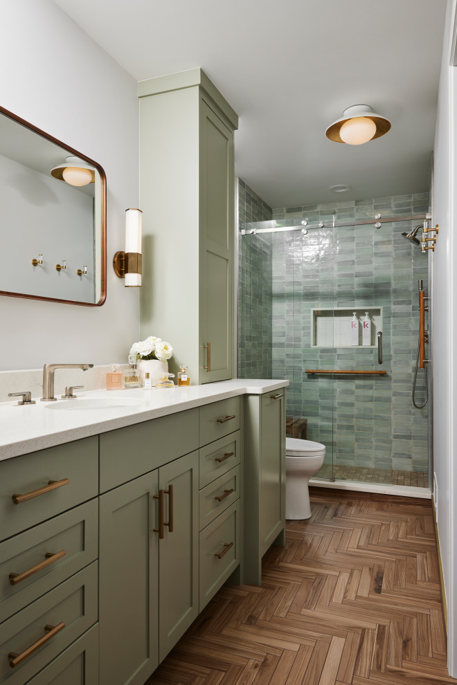 Inspiration for a mid-sized transitional master bathroom in Minneapolis with shaker cabinets, green cabinets, an alcove shower, a bidet, green tile, ceramic tile, white walls, porcelain floors, an undermount sink, engineered quartz benchtops, brown floor, a sliding shower screen, white benchtops, a niche, a single vanity and a built-in vanity.