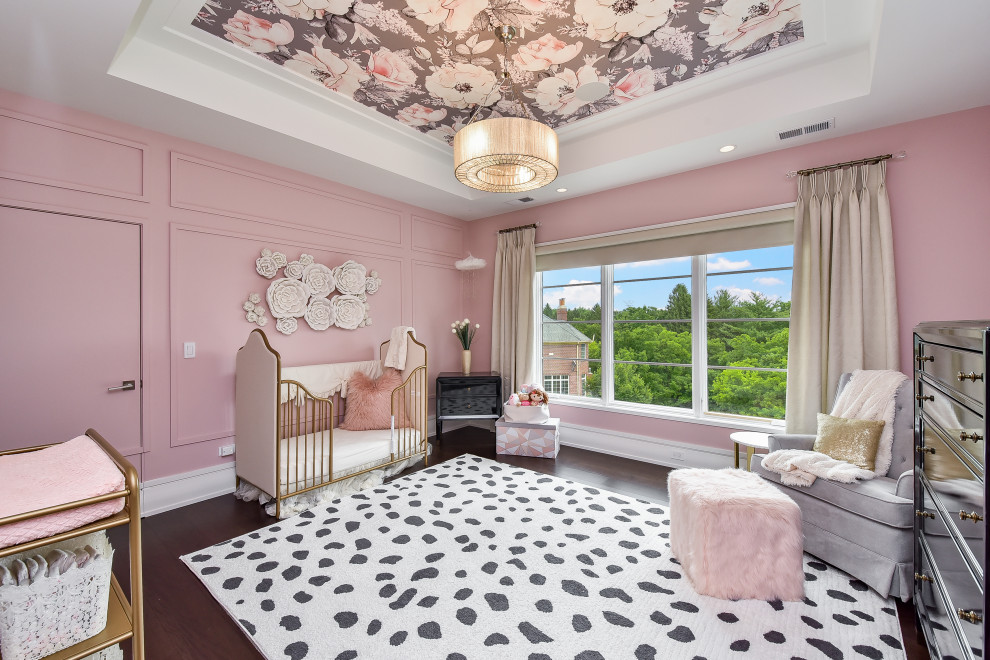 Mid-sized contemporary nursery in Chicago with pink walls, dark hardwood floors, brown floor, panelled walls, recessed and wallpaper.