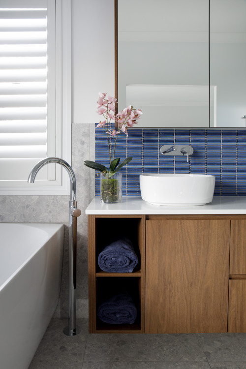 Modern Chic: Wood Flat-Panel Vanity in Blue Bathroom Backsplash Design